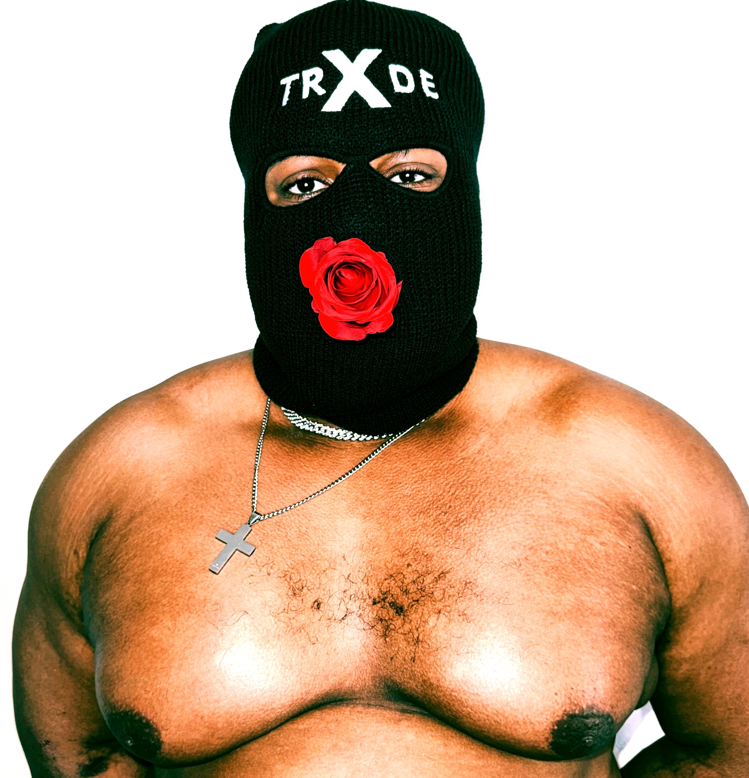 Person wearing a black balaclava with a red rose emblem and 'TRX DE' branding, on a white background.