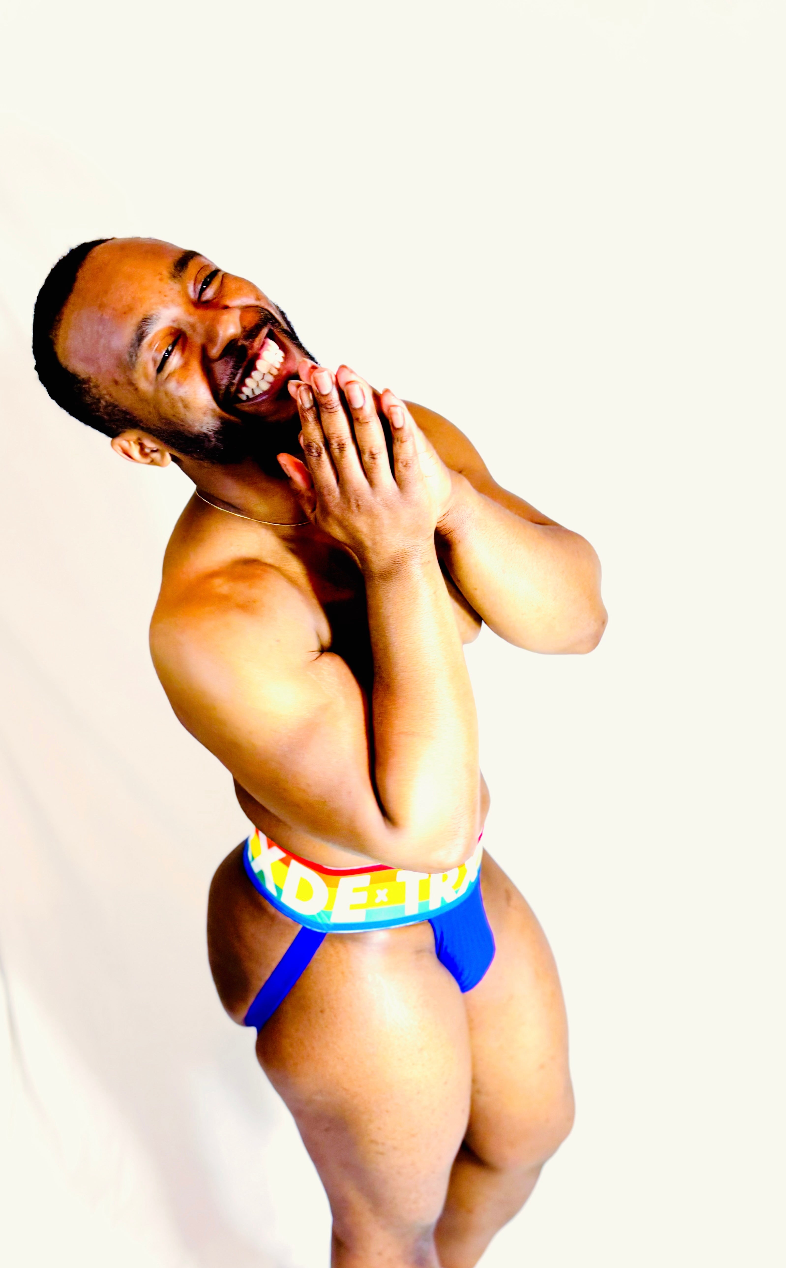 Man wearing colorful underwear on a white background
